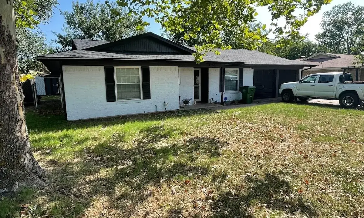 Professional roofing crew working on a residential roof in Ridgewood village